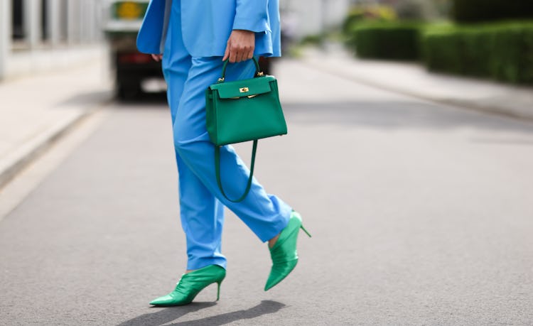 DUSSELDORF, GERMANY - MAY 03: Isabel Lapp wearing blue Aggi suit, Zara shoes and green Hermes Kelly ...