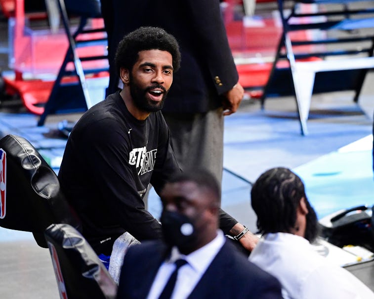 NEW YORK, NEW YORK - JUNE 07:  Kyrie Irving #11 and James Harden #13 of the Brooklyn Nets share a la...