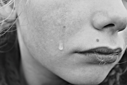A woman cries as an emotional manipulation tactic