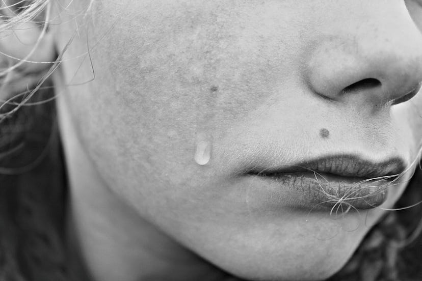 A woman cries as an emotional manipulation tactic