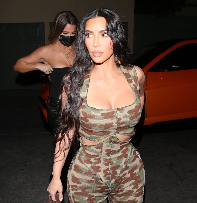 LOS ANGELES CA - MAY 22: Kim Kardashian along with her sister Khloe Kardashian step out to dinner to...