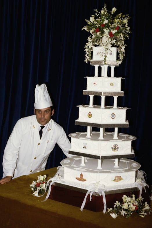 Chief petty officer cook David Avery with the royal wedding cake made for Prince Charles and Princes...
