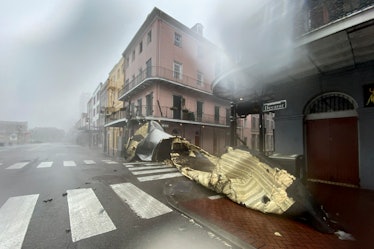 TOPSHOT - A section of a building's roof is seen after being blown off during rain and winds in the ...