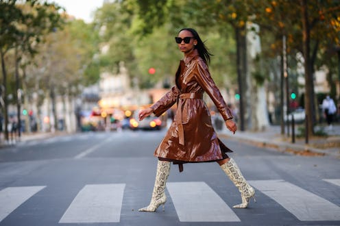 PARIS, FRANCE - AUGUST 25: Emilie Joseph @in_fashionwetrust wears black large sunglasses, silver ear...
