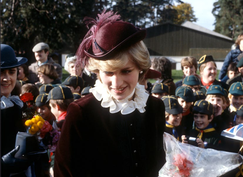 Princess Diana in maroon velvet.