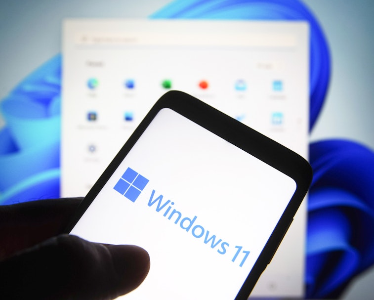 UKRAINE - 2021/06/24: In this photo illustration a Windows 11 logo is seen on a smartphone screen wi...