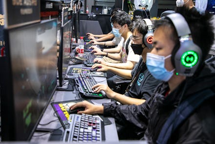 SHANGHAI, CHINA - JULY 31: People play online games at the booth of Huya, a Chinese live-streaming p...