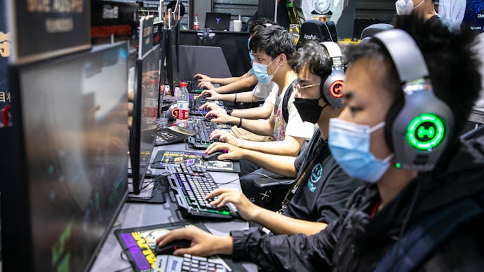 SHANGHAI, CHINA - JULY 31: People play online games at the booth of Huya, a Chinese live-streaming p...