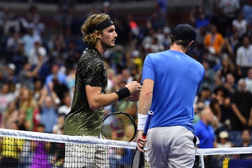 TOPSHOT - Greece's Stefanos Tsitsipas (L) shakes hands with Britain's Andy Murray after winning thei...