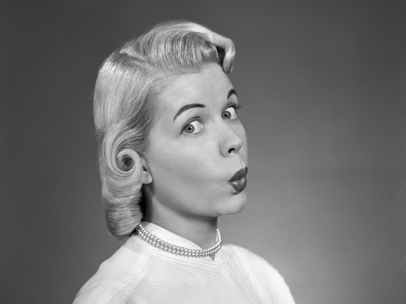 UNITED STATES - Circa 1950s: Blonde Woman Page Boy Hair Pearl Necklace White Blouse 3 4 Profile Loo...