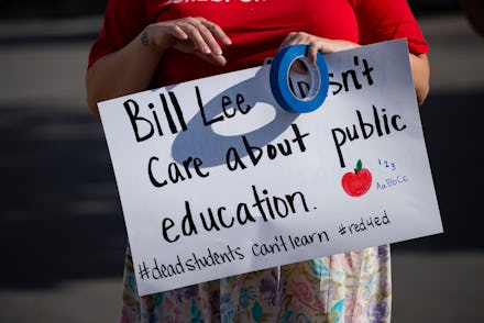 NASHVILLE, TN - JULY 27: A protester prepares a sign before a protest against the reopening of scho...