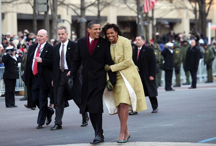 US President Barack Obama and First Lady Michelle walk the Inaugural Parade route after Obama was sw...