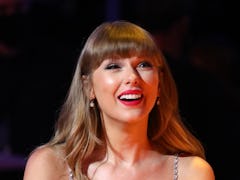 LONDON, ENGLAND - MAY 11: Taylor Swift, winner of the Global icon Award, reacts during The BRIT Awar...