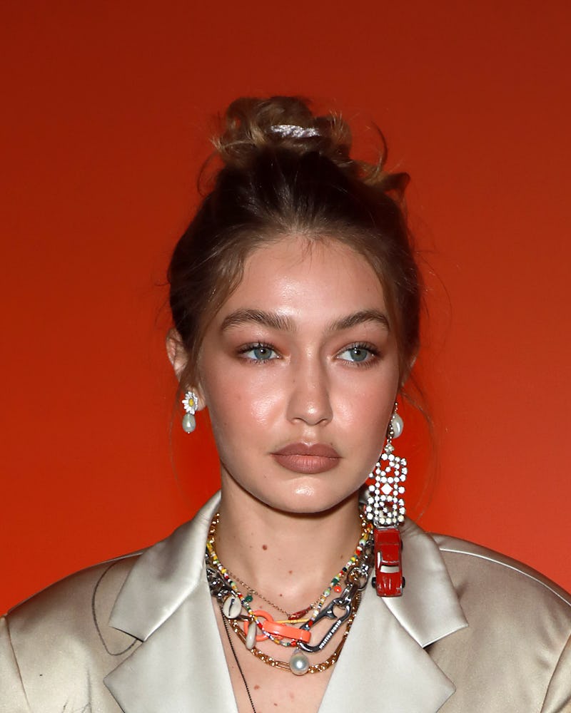 Gigi Hadid wears mismatched earrings while attending the Heron Preston Menswear Spring/Summer 2020 s...