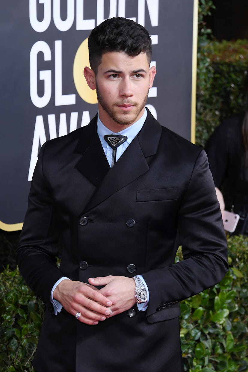 Celebrity Nick Jonas attends the Golden Globes.