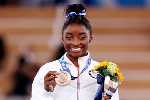 TOKYO, JAPAN - AUGUST 03: Simone Biles of Team United States poses with the bronze medal during the ...