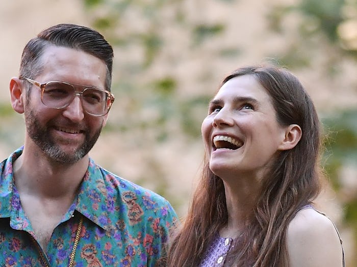(FILES) In this file photo taken on June 13, 2019 Former US convict Amanda Knox (R) along with her b...