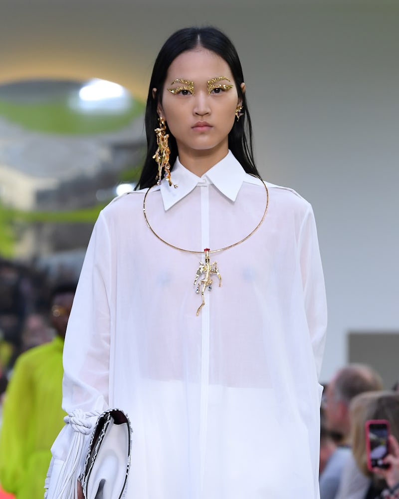 A model wears mismatched earrings during the Valentino Spring/Summer 2020 runway show as part of Par...