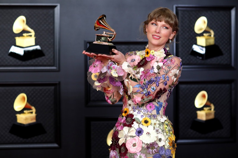 Taylor Swift posing with her Grammy for winning Album of the Year. (Jay L. Clendenin / Los Angeles T...