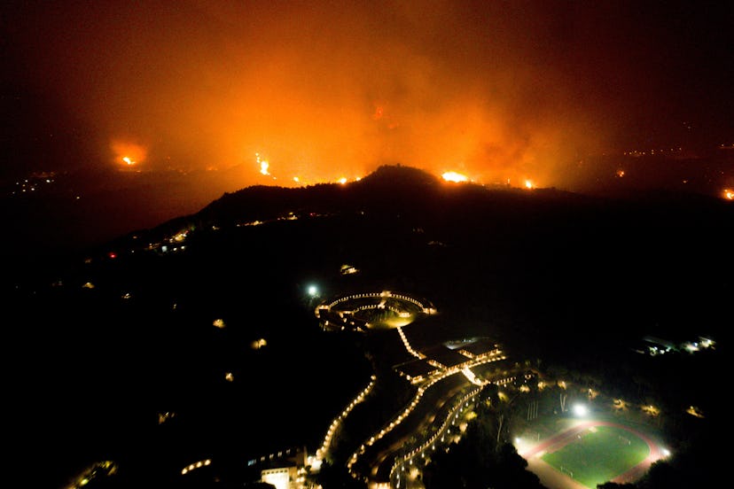 TOPSHOT - A wildfire approaches the Olympic Academy in ancient Olympia in western Greece on August 4...