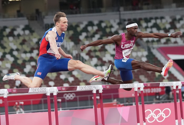 Karsten Warholm L of Norway and Rai Benjamin of the United States compete during the men's 400m hurd...