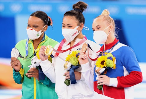 Athletes Rebecca Andrade of Brazil, Sunisa Lee of the US and Angelina Melnikova pose with their Olym...