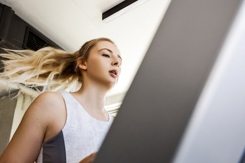 Trainers break down elliptical vs. treadmill benefits and how to choose between the two cardio machi...