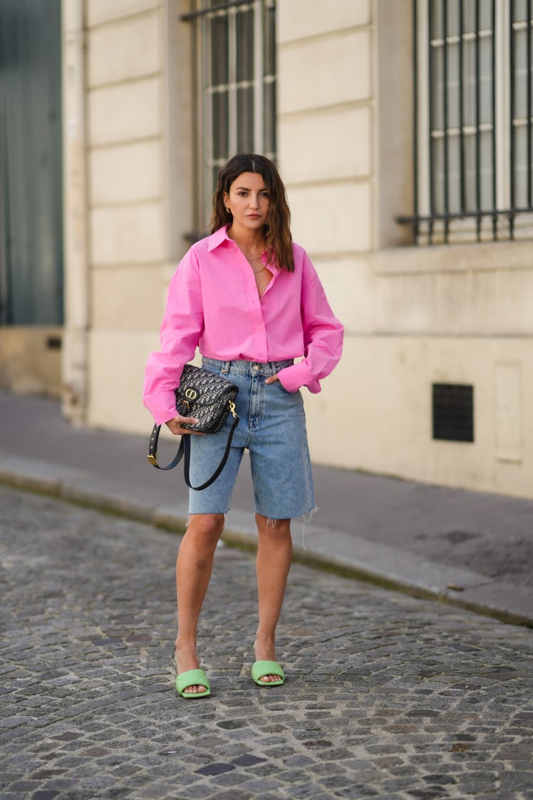 PARIS, FRANCE - APRIL 26: Alexandra Pereira wears a neon pink open oversized shirt from The Frankie ...