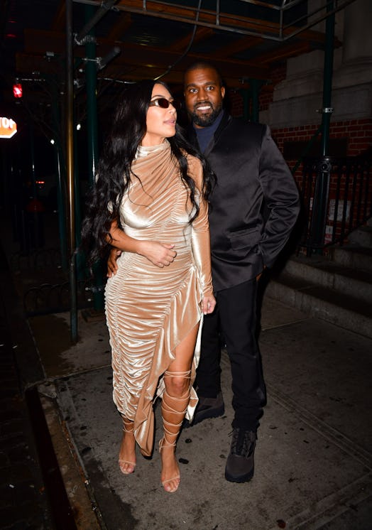 Kim Kardashian West and Kanye West wearing formal clothing in 2019. 