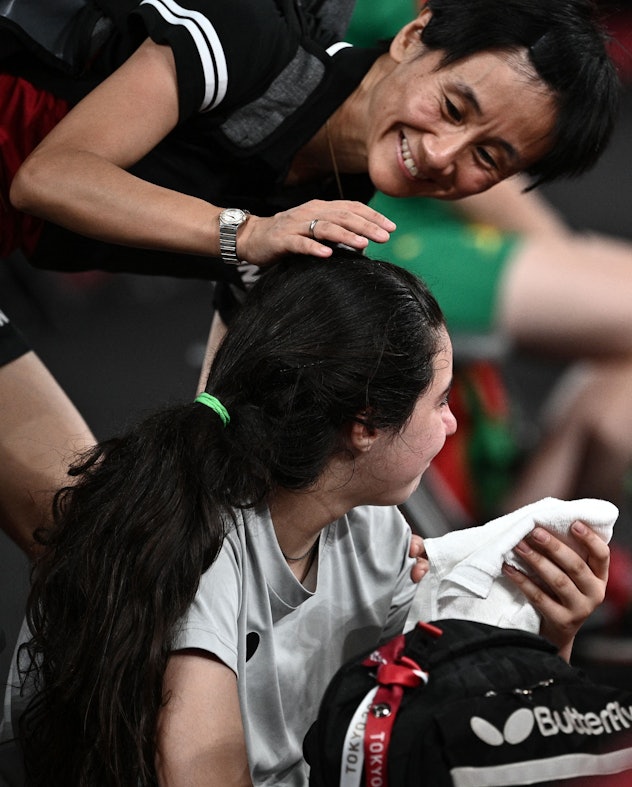 Liu Jia is competing in table tennis.