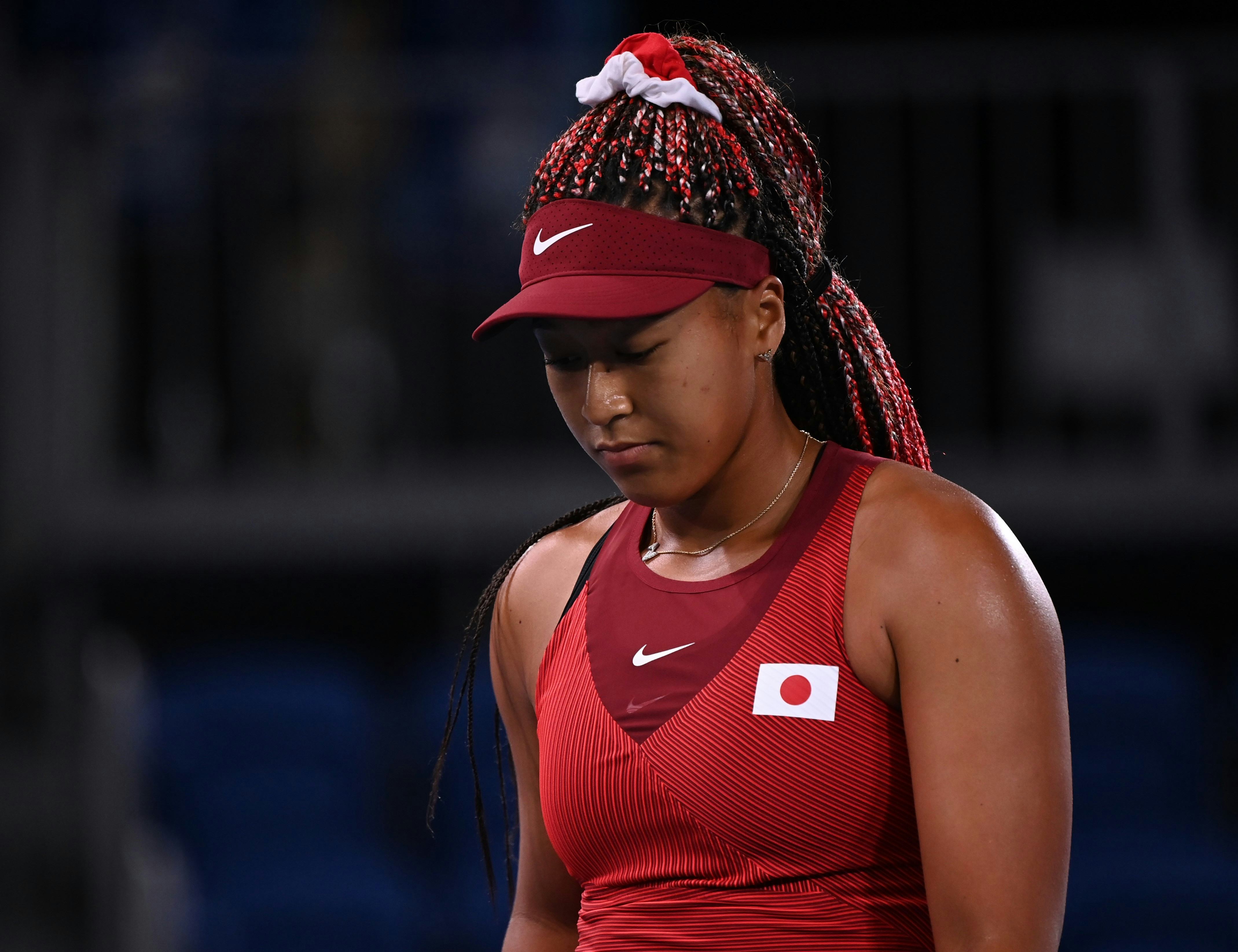 Naomi Osaka's box braids, Suni Lee's eyelash extensions, and Simone Biles' soft glam  were some of t...