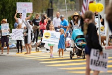 REDONDO BEACH, CA - JULY 27: Let Them Breathe, an anti-mask group, gather to protest at the Redondo ...