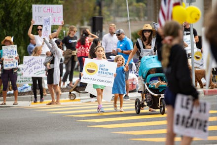 REDONDO BEACH, CA - JULY 27: Let Them Breathe, an anti-mask group, gather to protest at the Redondo ...