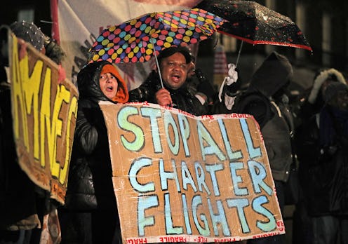 Campaigners outside Downing Street, London, protest against government plans to deport 50 people to ...