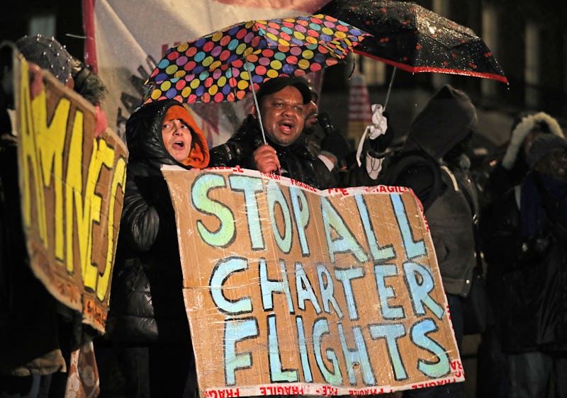 Campaigners outside Downing Street, London, protest against government plans to deport 50 people to ...