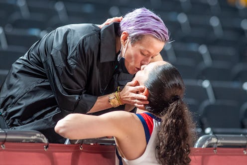 TOKYO, JAPAN August 8: Sue Bird #6 of the United States is congratulated by partner US soccer player...
