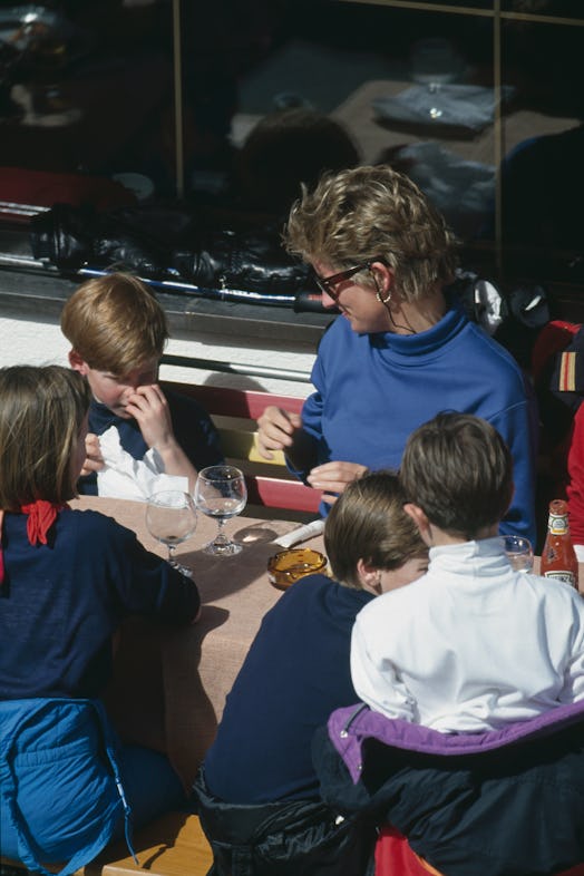 Princess Diana (1961 - 1997) having lunch with her sons Prince Harry and Prince William during a hol...