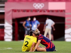 Olympians Sam Kerr and Kristie Mewis confirm their romance with a PDA-filled Instagram post.