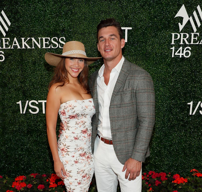 BALTIMORE, MARYLAND - MAY 15: (L-R) Camila Kendra and Tyler Cameron attend Preakness 146 hosted by 1...