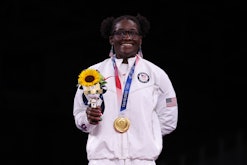 Gold medalist USA's Tamyra Mariama Mensah-Stock poses with her medal after the women's freestyle 68k...