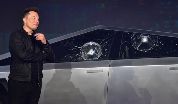 Tesla co-founder and CEO Elon Musk verbally reacts in front of the newly unveiled all-electric batte...