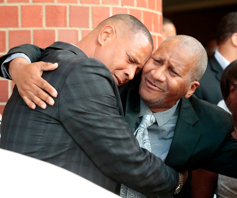 Clarence Franklin, Aretha Franklin's son, hugs an attendee after his mother's funeral at the Greater...