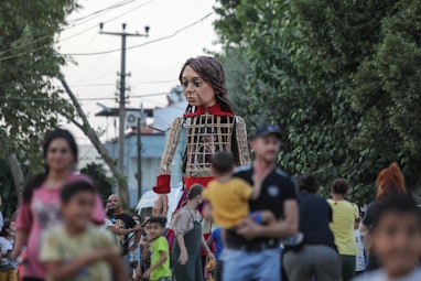 IZMIR, TURKEY - AUGUST 04: The 'Little Amal', 3.5-meter tall puppet en route to the UK prepared as p...