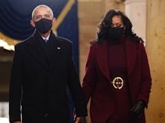 WASHINGTON, DC - JANUARY 20: Former US President Barack Obama (L) and Michelle Obama arrive in the C...