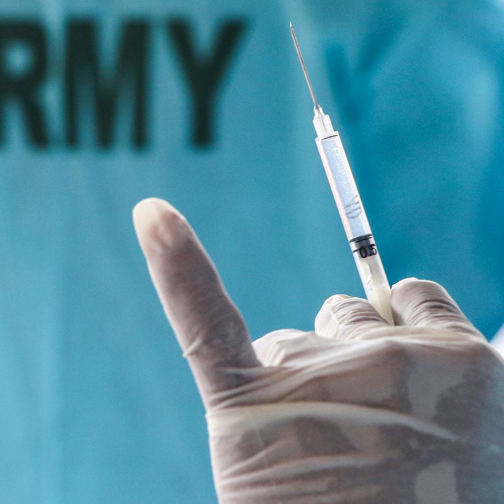 COLOMBO, SRI LANKA - 2021/08/03: Army health official prepares a dose of the AstraZeneca vaccine in ...