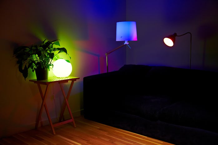 A living room setup with lamps using Philips Hue iPhone-controlled lightbulbs photographed during a ...
