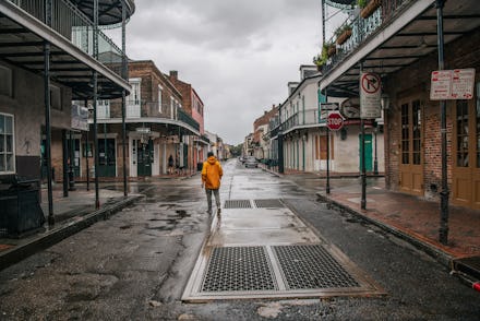 NEW ORLEANS, LOUISIANA - AUGUST 29: A person walks through the French Quarter ahead of Hurricane Ida...