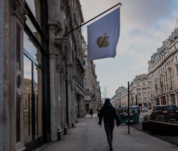 LONDON, UNITED KINGDOM - 2021/02/10: A man walking past the Apple stores  in London, during the thir...