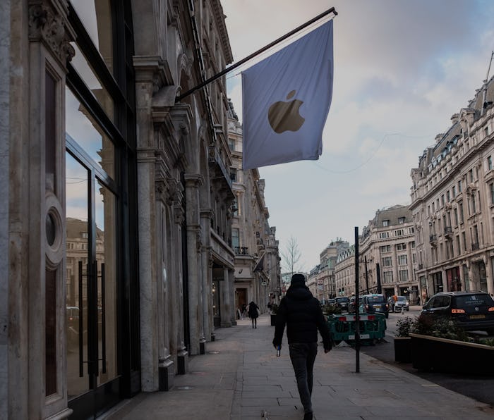 LONDON, UNITED KINGDOM - 2021/02/10: A man walking past the Apple stores in London, during the thir...