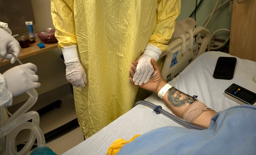 LOS ANGELES, CA - FEBRUARY 01: Registered Nurse Jess Esperti, left, holds Mariano Zuniga Anaya's han...